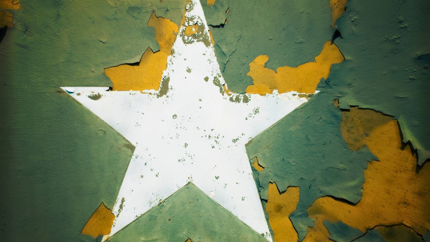 Military star insignia on weathered armour plating