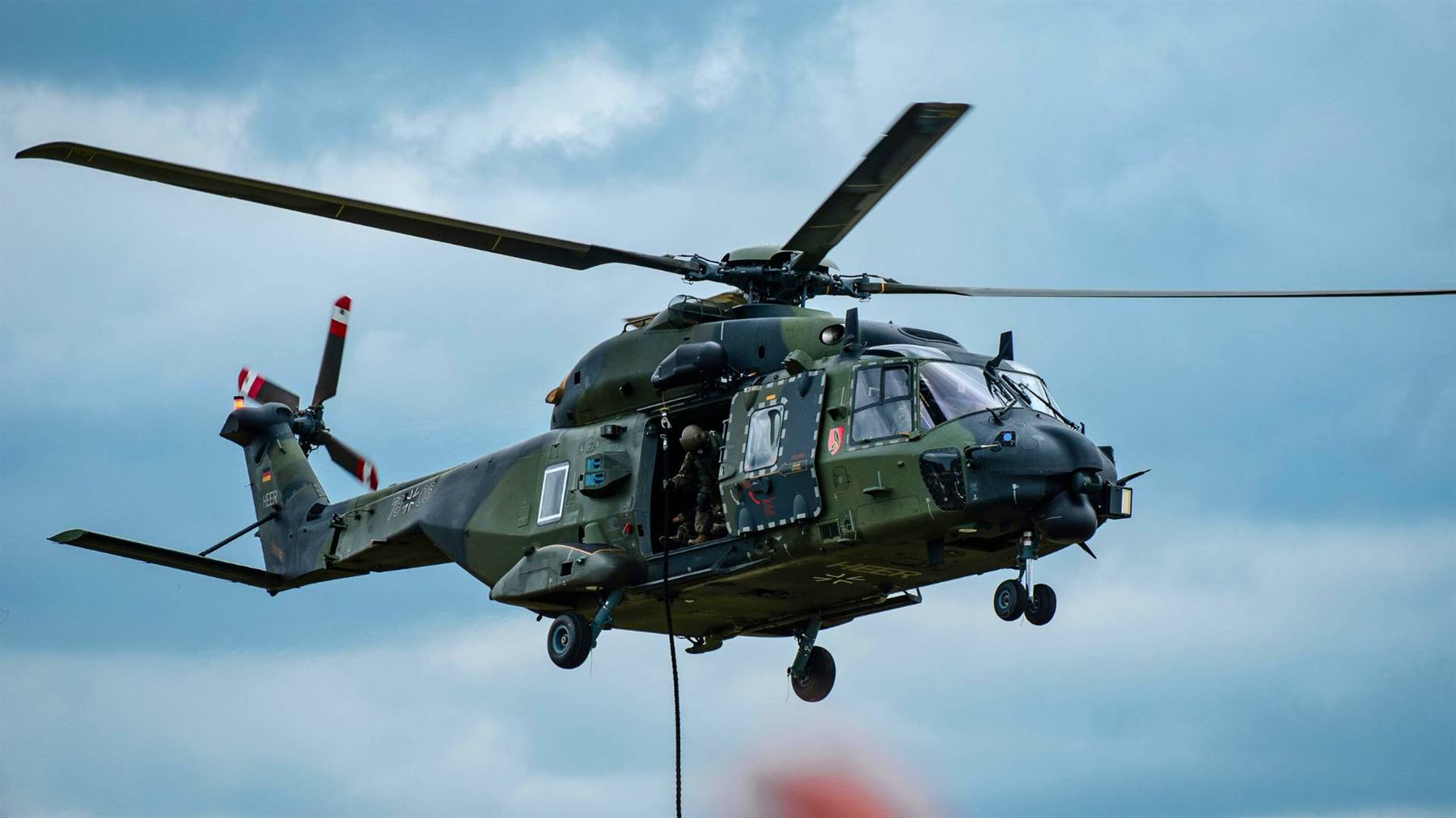 Military rotary-wing aircraft in flight