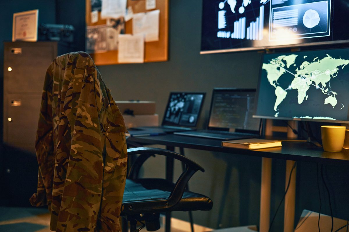 Defense operations centre with global monitoring displays
